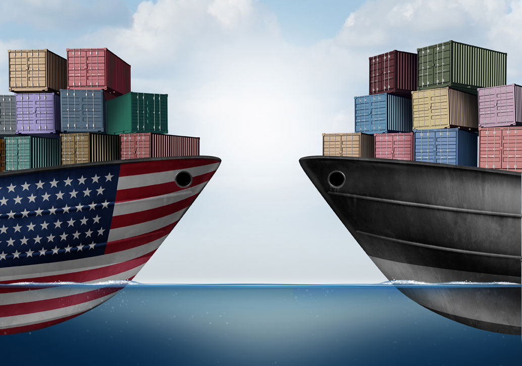 Two cargo ships, one painted with a United States flag and one from another country